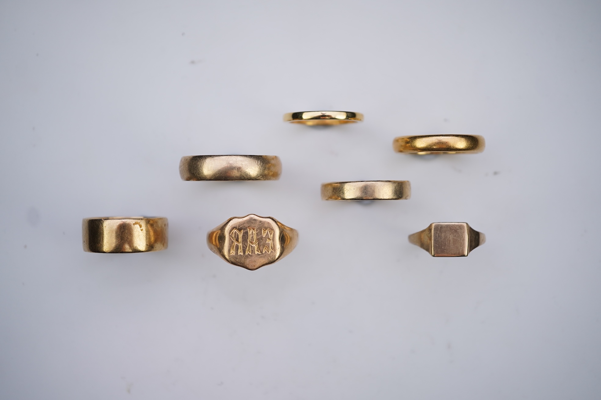 A collection of seven gold rings